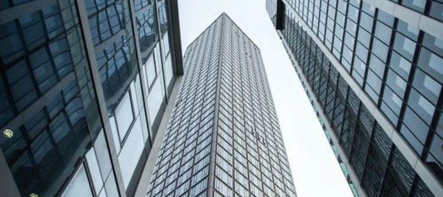 vertical-low-angle-shot-high-rise-skyscrapers-glass-facade-frankfurt-germany-1 (1)