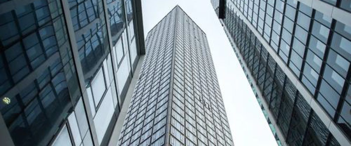 vertical-low-angle-shot-high-rise-skyscrapers-glass-facade-frankfurt-germany-1 (1)